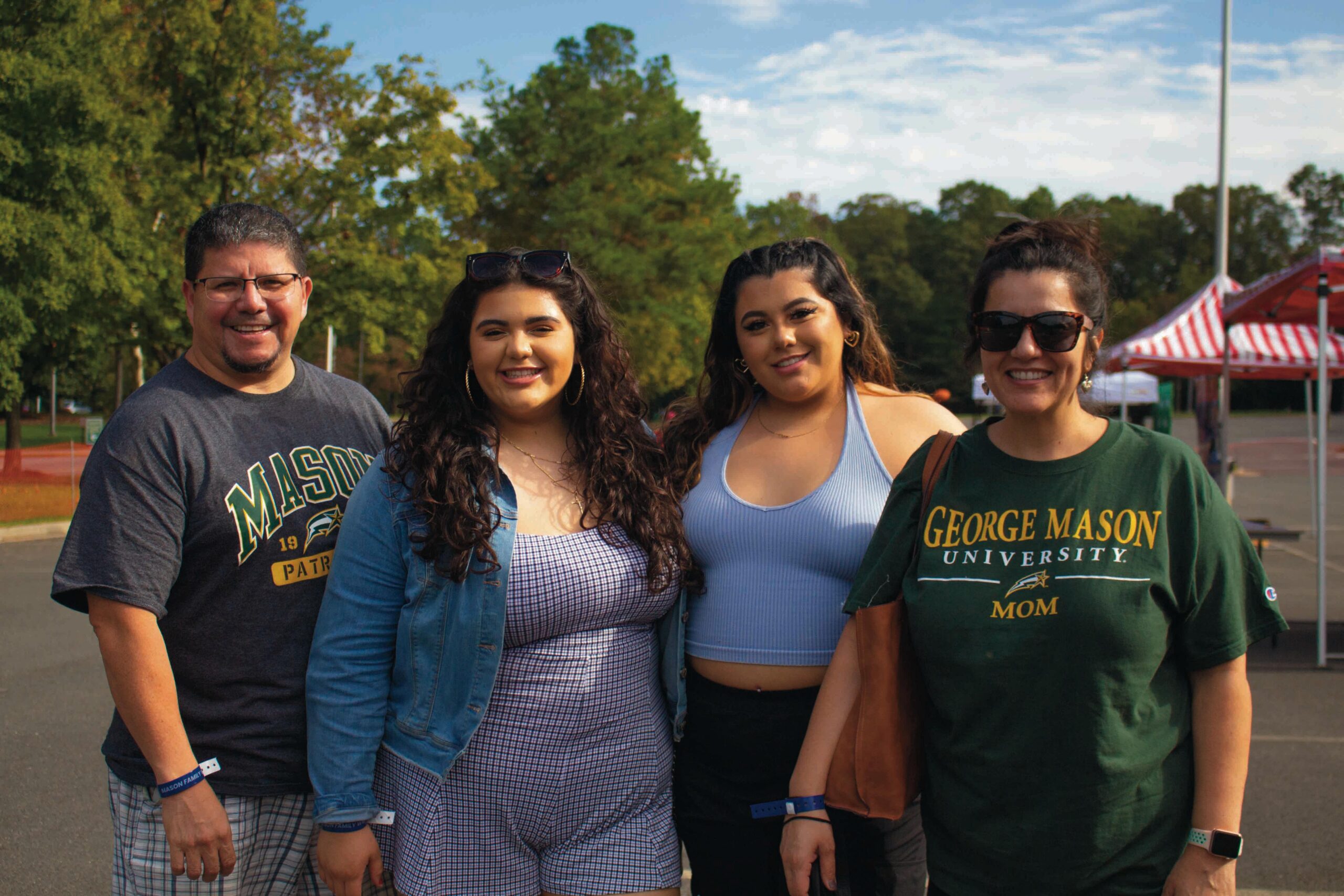 Photo of a family from family weekend in george mason t-shirts